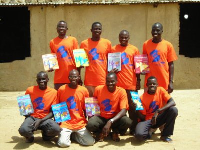 Teachers display their new English books, donated by Book Wish Foundation